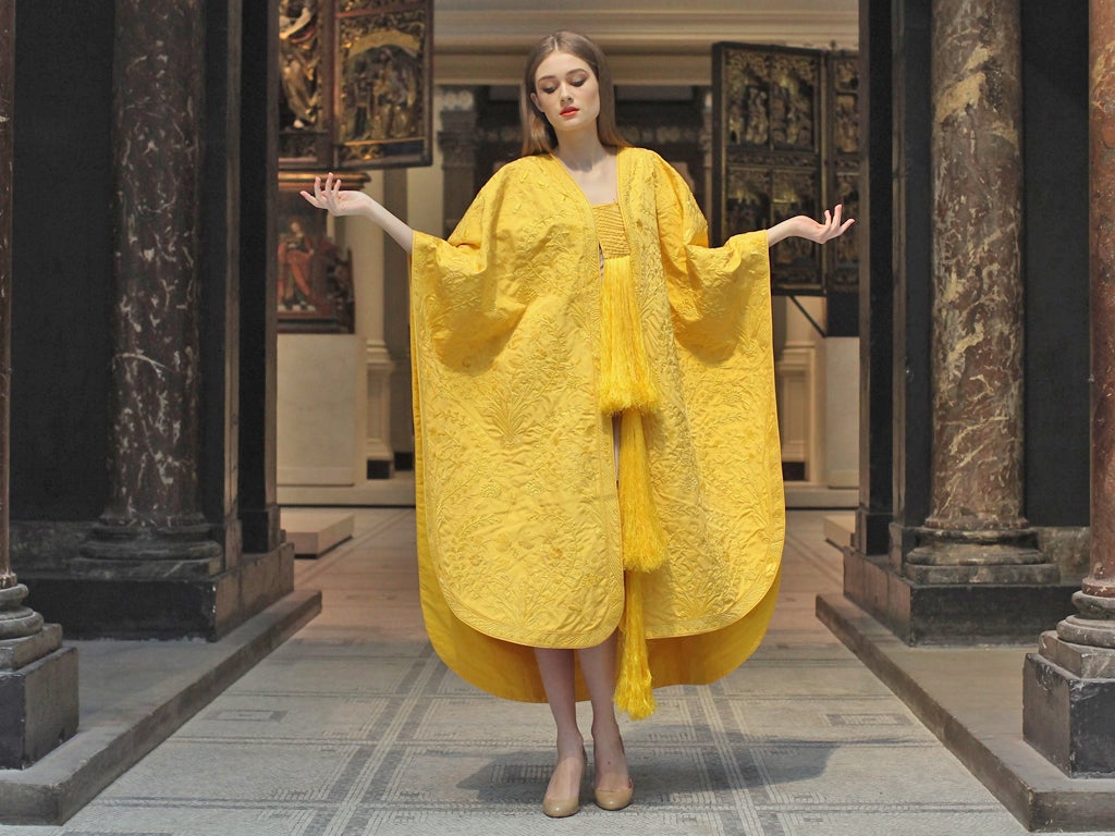 Model Bianca Gavrilas wears a a hand-embroidered cape made from the silk of the Golden Orb Spider in the V&A Museum's Medieval and Renaissance Gallery