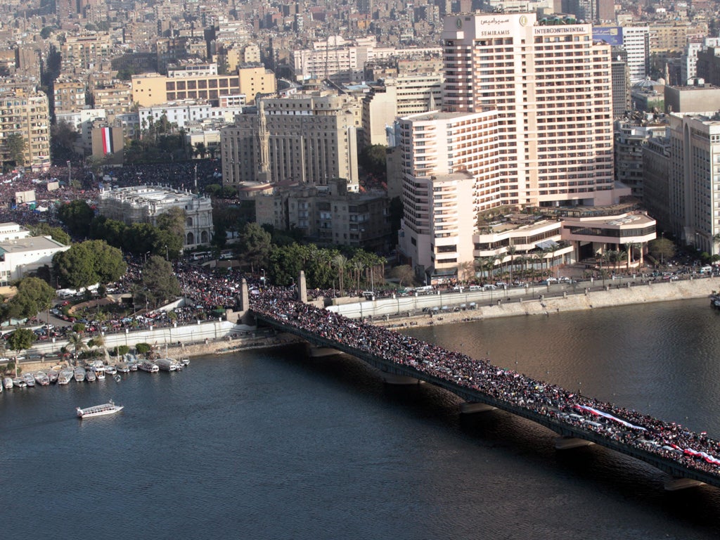 Protesters celebrate the one year annivesary of the 25th January uprising in Cairo