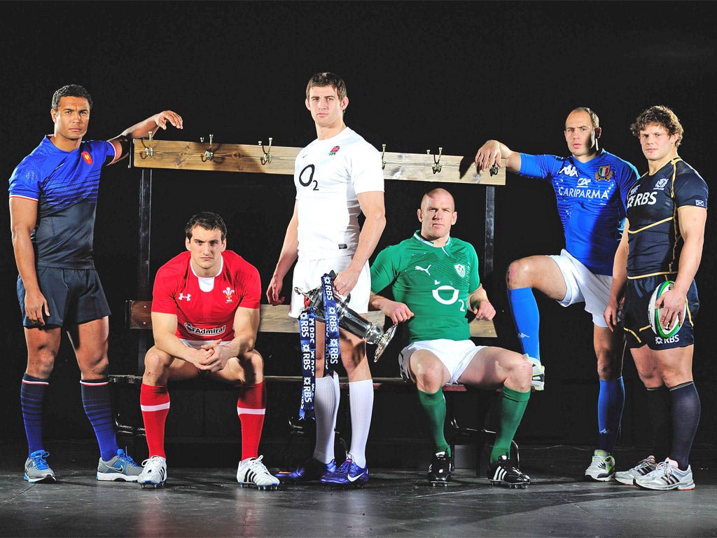 England's Tom Wood poses holding the Six Nations trophy with the rugby captains of the other competing nations including; Thierry Dusautoir of France, Sam Warburton of Wales, Paul O'Connell of Ireland, Sergio Parisse of Italy and Ross Ford of Scotland