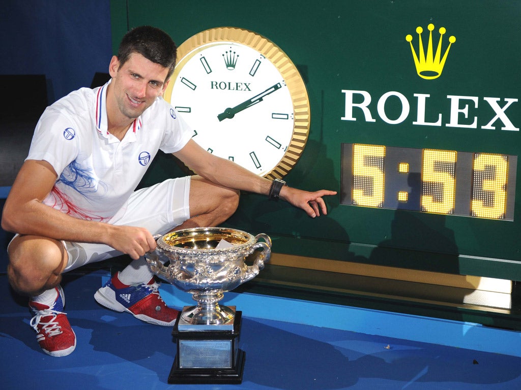 Novak Djokovic can finally afford to smile after a
punishing five hours and 53 minutes on court with Rafa Nadal that earned him his third Australian Open
title last night