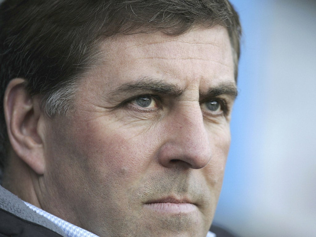 Bristol Rovers manager Mark McGhee plans
to climb back up the leagues