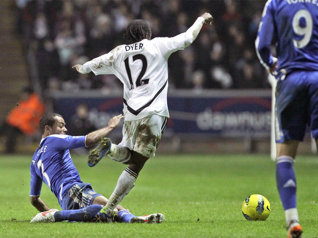 Chelsea's Ashley Cole brings down Nathan Dyer of Swansea to earn his second yellow card of the night at the Liberty Stadium