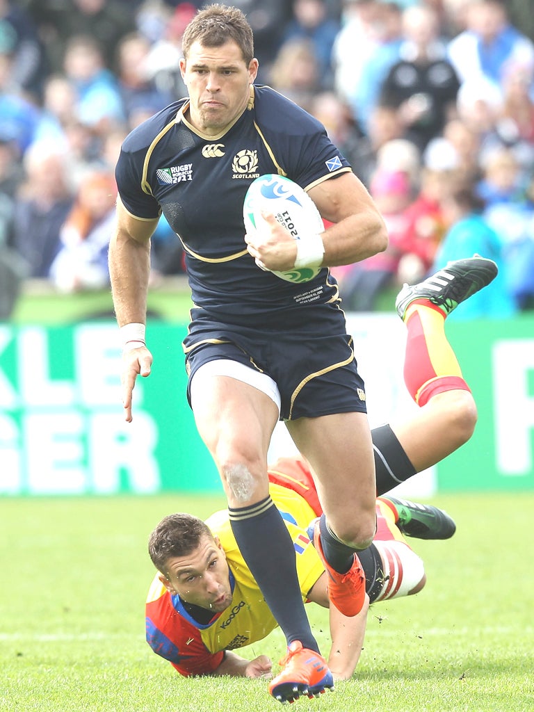 Scotland's Sean Lamont runs out of a tackle