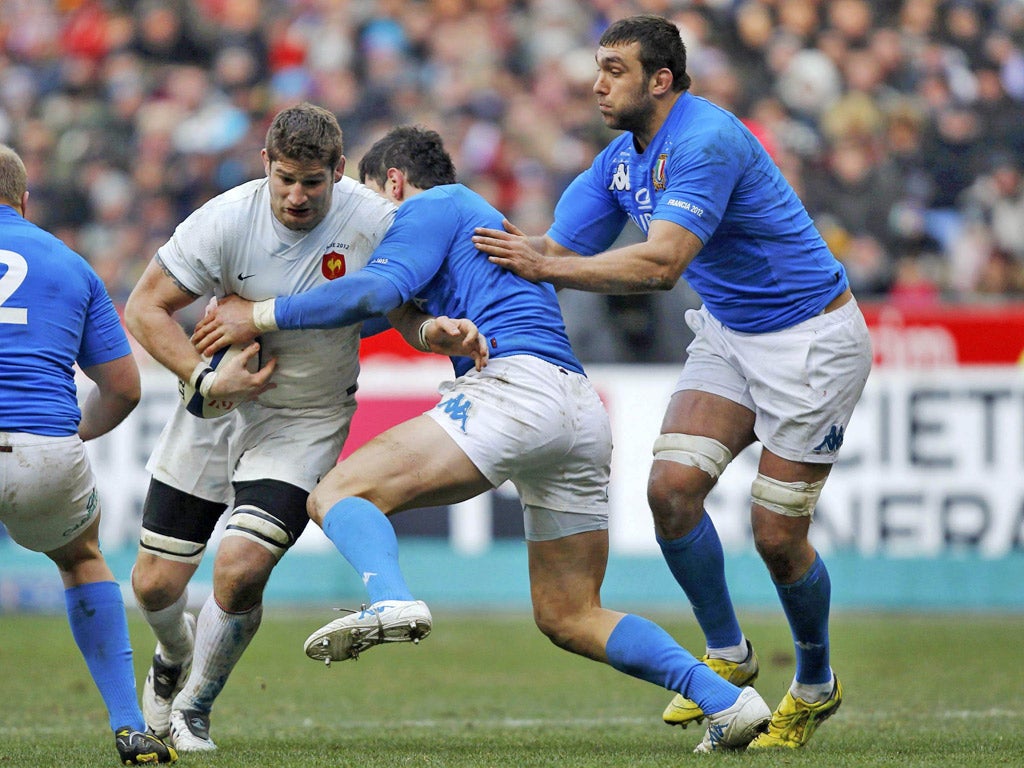 Pascal Pape fights for the ball with Italy's Cornelius Van Zyl