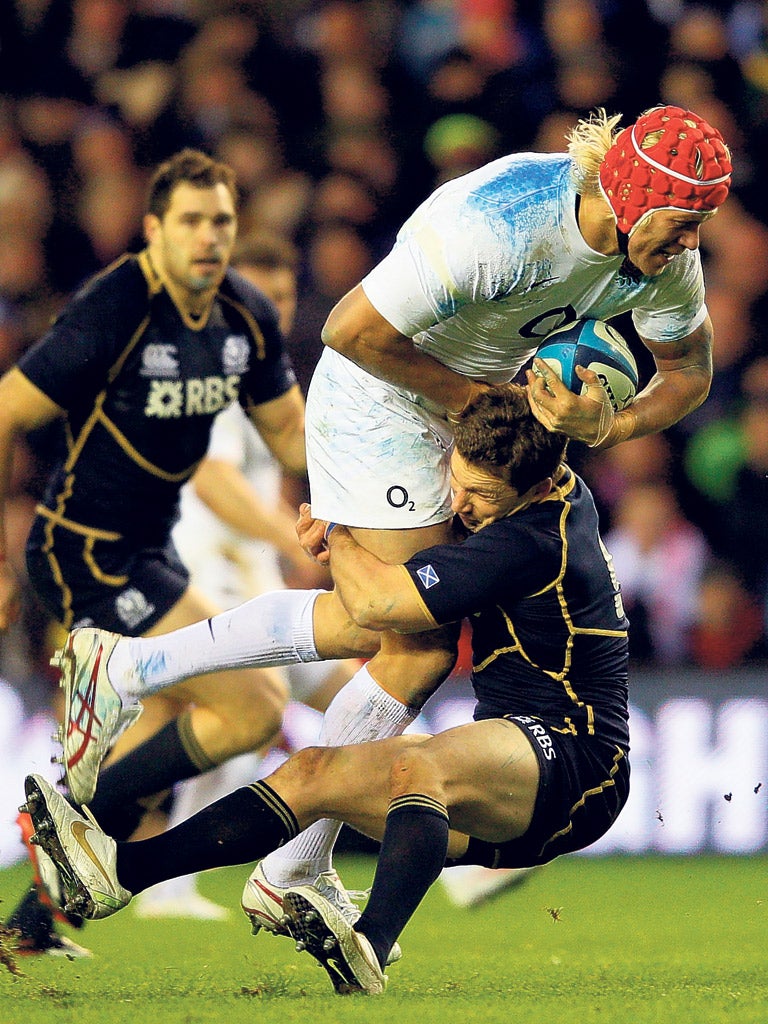 England’s Mouritz Botha is given a Scottish welcome as Chris Cusiter brings him down