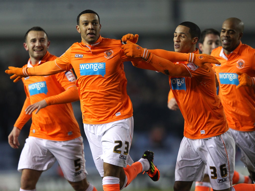 Matt Phillips celebrates giving Blackpool the lead last night