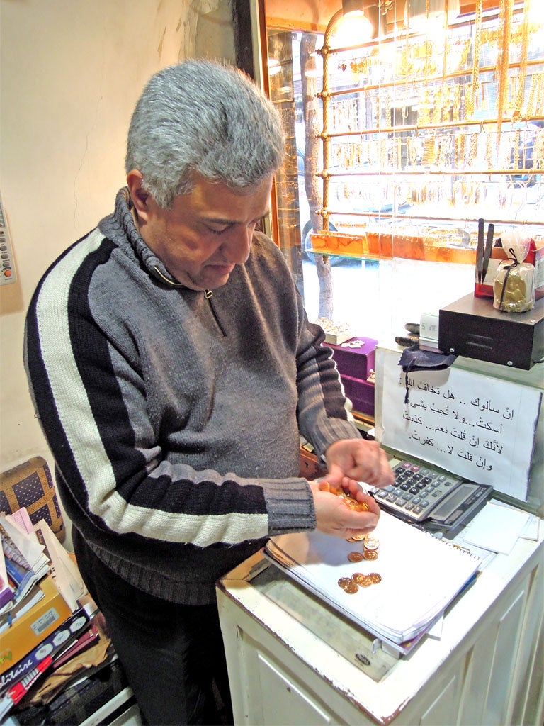 Gold seller Nicolas Karout is seeing a roaring trade in gold sovereigns