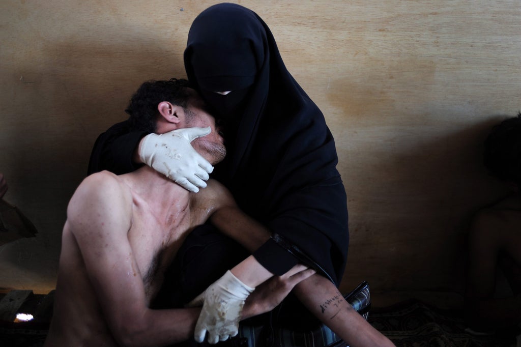 <p>World Press Photo of the Year, Samuel Aranda</p>
<p>A woman holds a wounded relative in her arms, inside a mosque used as a field hospital by demonstrators against the rule of President Ali Abdullah Saleh, during clashes in Sanaa, Yemen on 15 October 2011.</p>