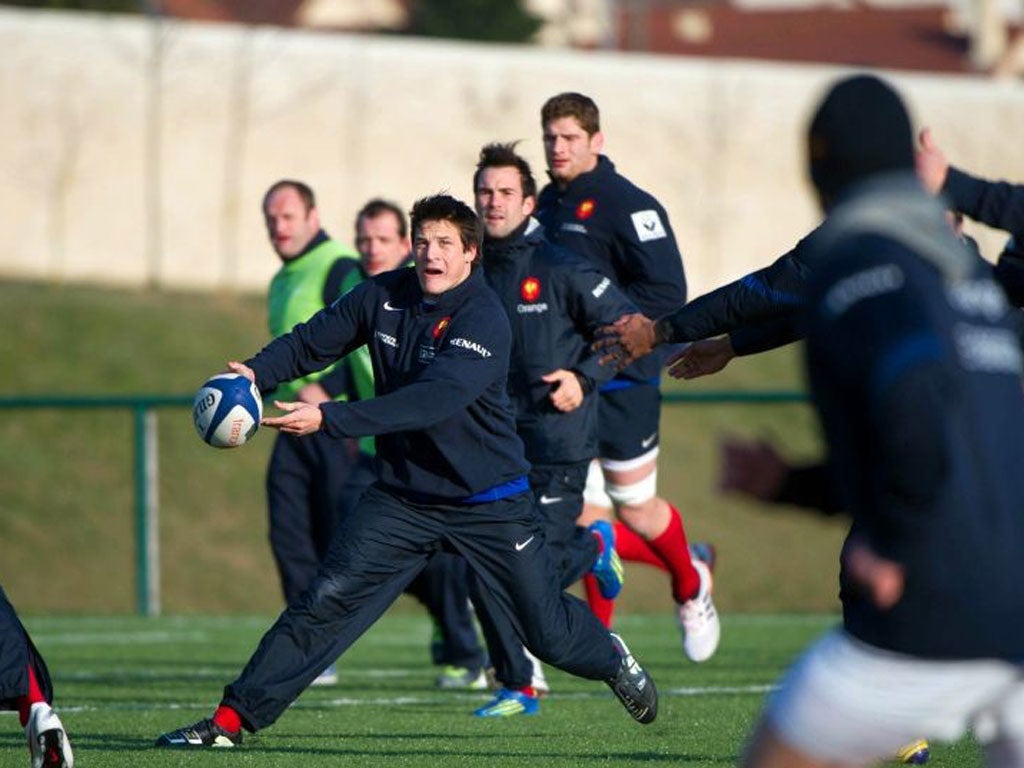 France's fly-half François Trinh-Duc runstraining yesterday