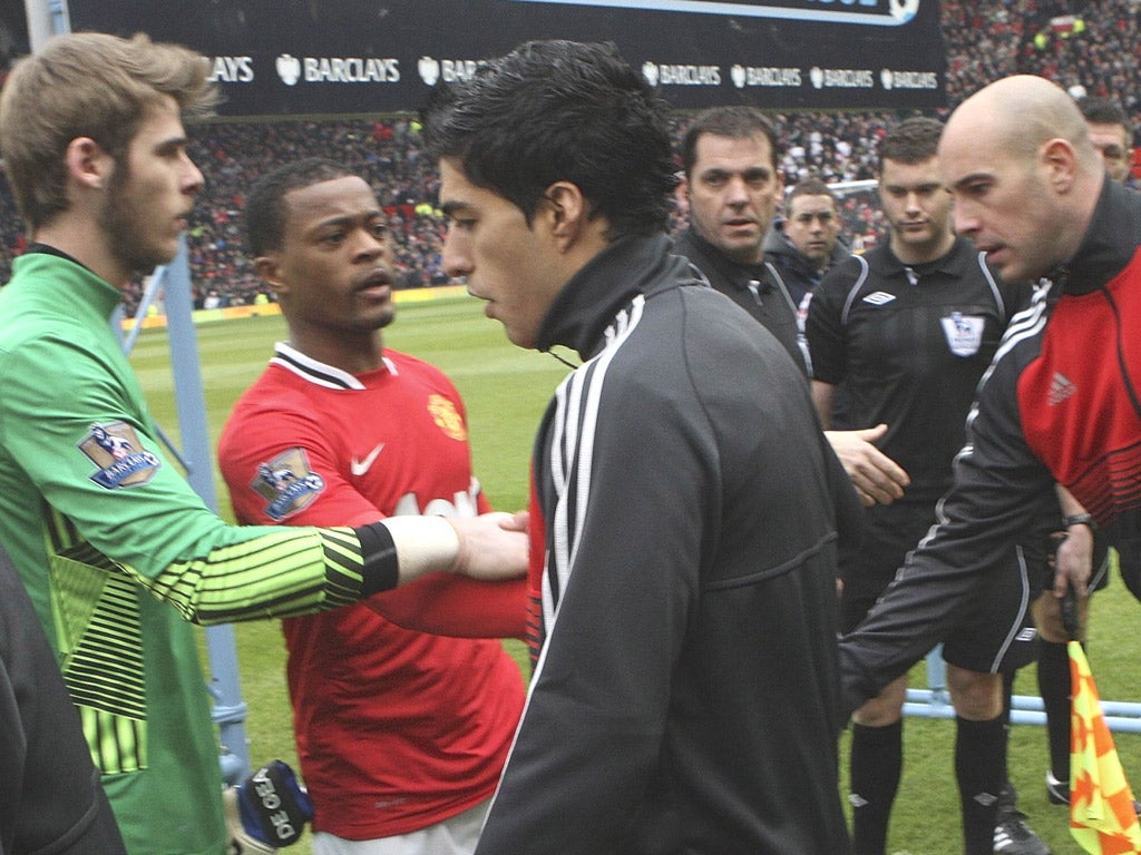 Handbags, no handshakes: Suarez refuses to shake Evra’s hand