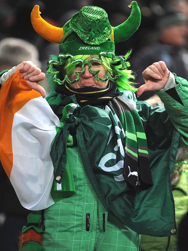 An Irish fan gives the thumbs down after the France-Ireland match was postponed just before kick-off on Saturday at the Stade de France