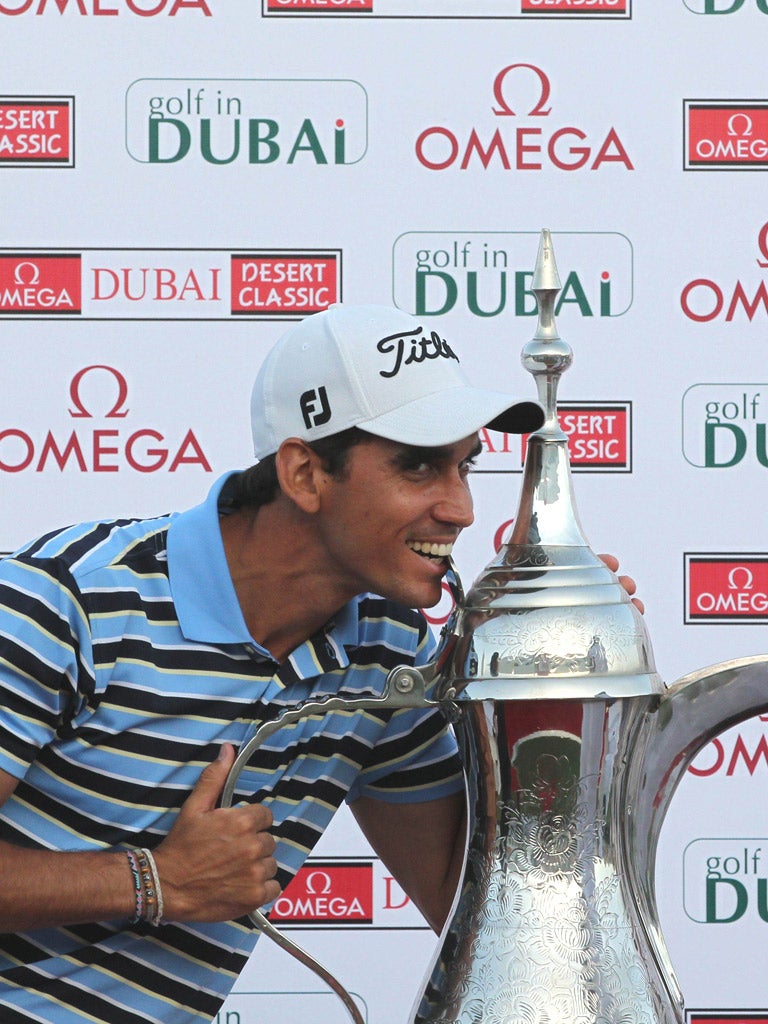 Rafael Cabrera-Bello takes a ‘bite’ out of the Desert Classic trophy