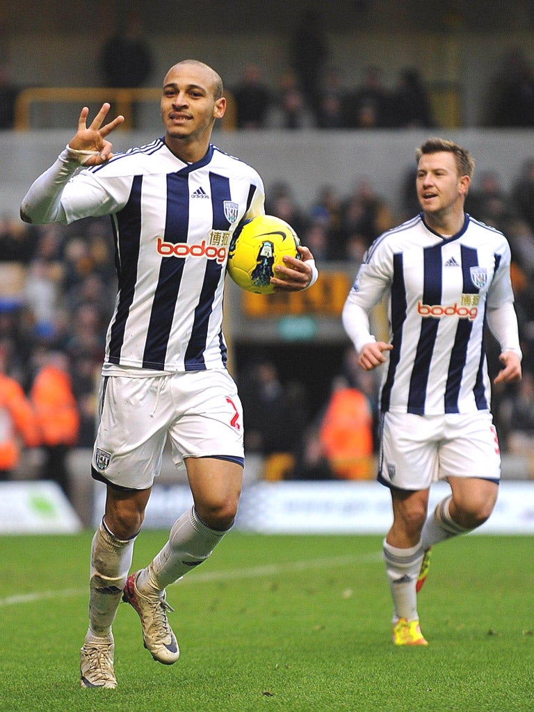 West Brom striker Peter Odemwingie celebrates completing his hat-trick