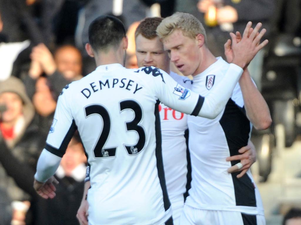 Pogrebnyak is congratulated by his Fulham team-mates
