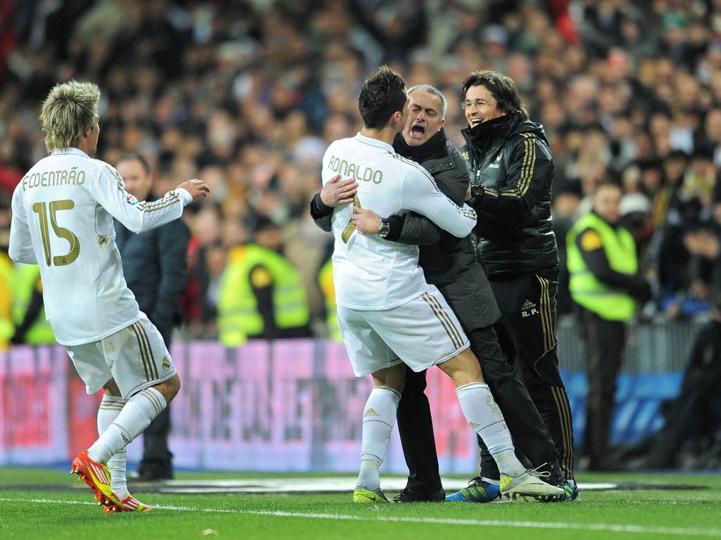 Ronaldo, who scored a hat-trick, celebrates with Mourinho