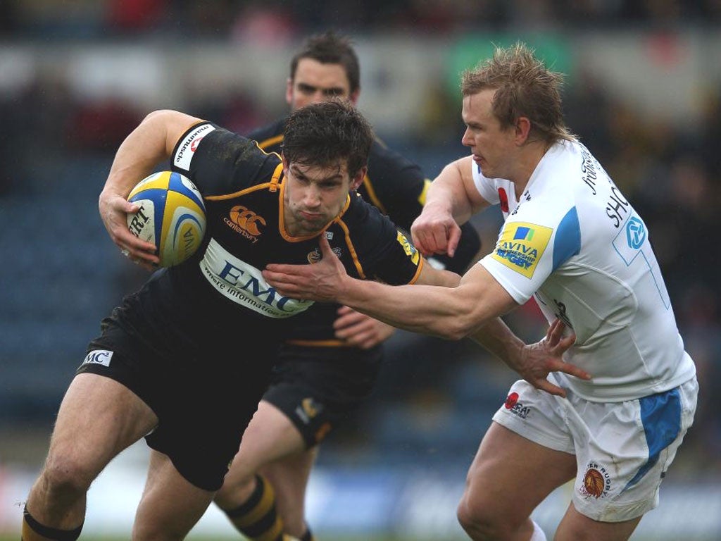 Exeter’s Jason Shoemark tackles Dominic Waldouck, of Wasps