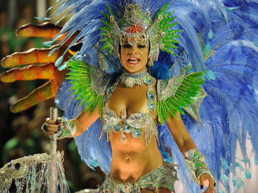 A reveller of the Beija Flor samba school performs at the Sambadrome