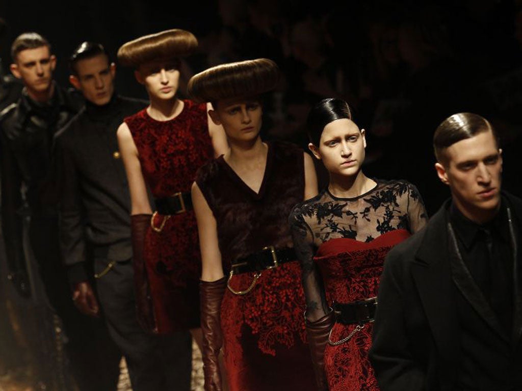 On a catwalk strewn with fallen leaves, models, male and female, came out in military great coats, Black Watch tartans, quilted velvet and tulle scattered with brightly coloured blooms.