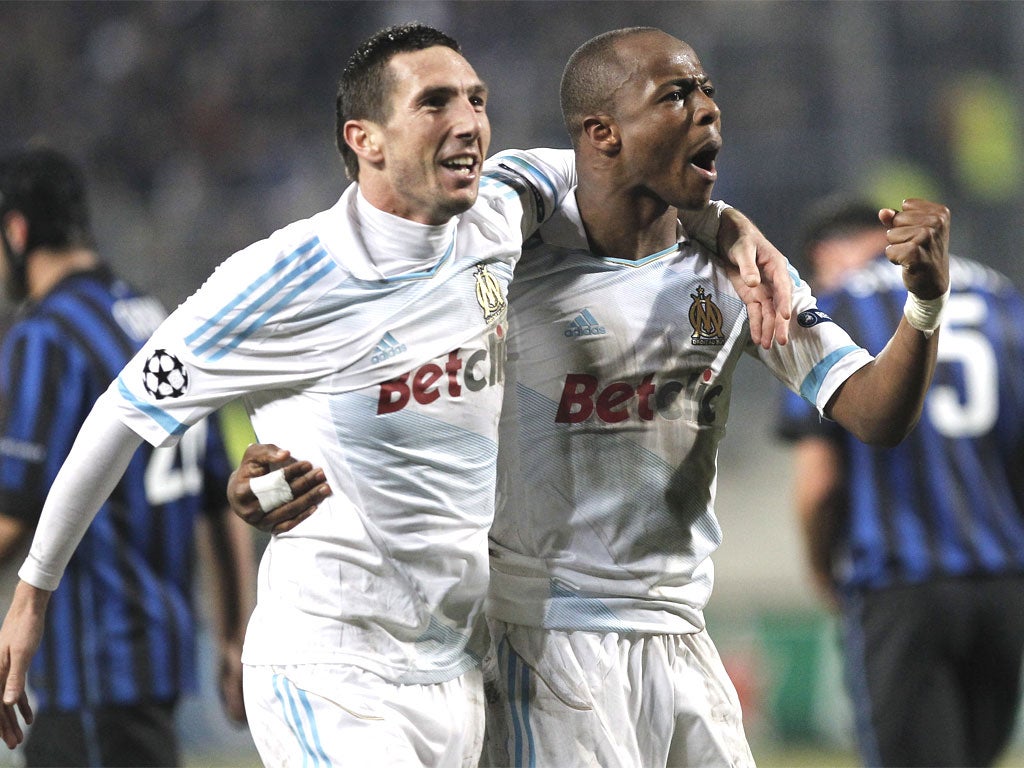 Marseille's Andre Ayew, right, celebrates his goal with Morgan Amalfitano