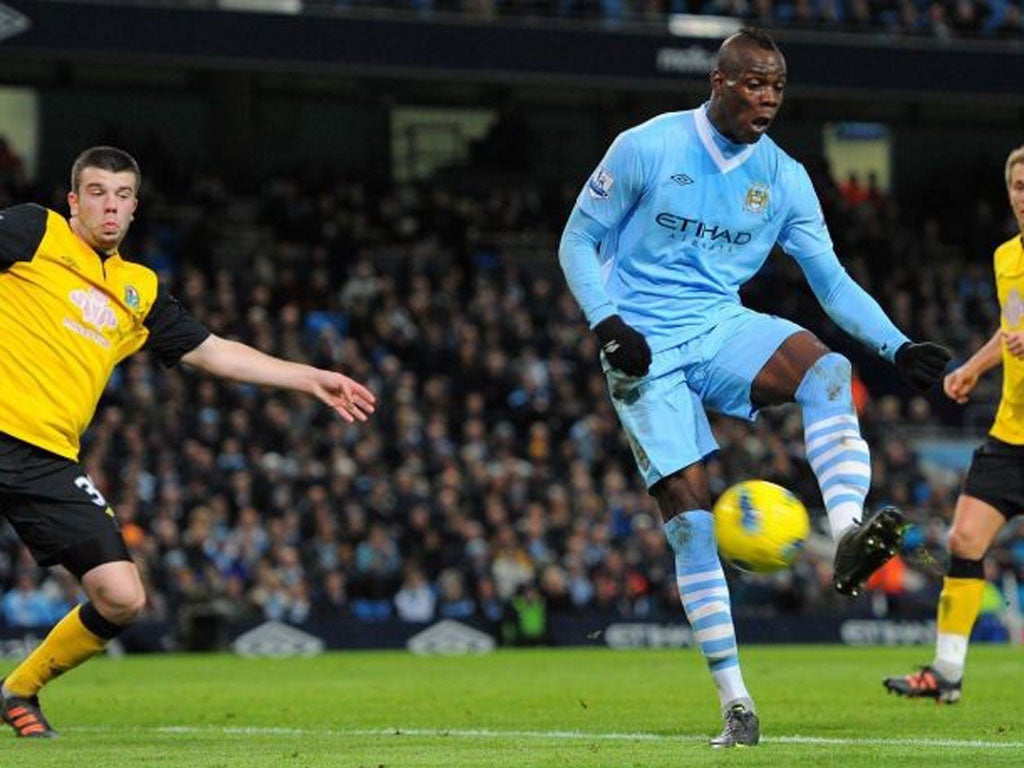 Mario Balotelli collects the ball at the Etihad Stadium