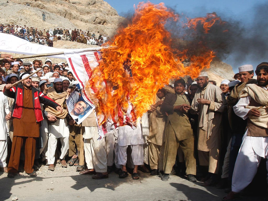 Afghan demonstrators burn a US flag in Jalalabad province on Friday