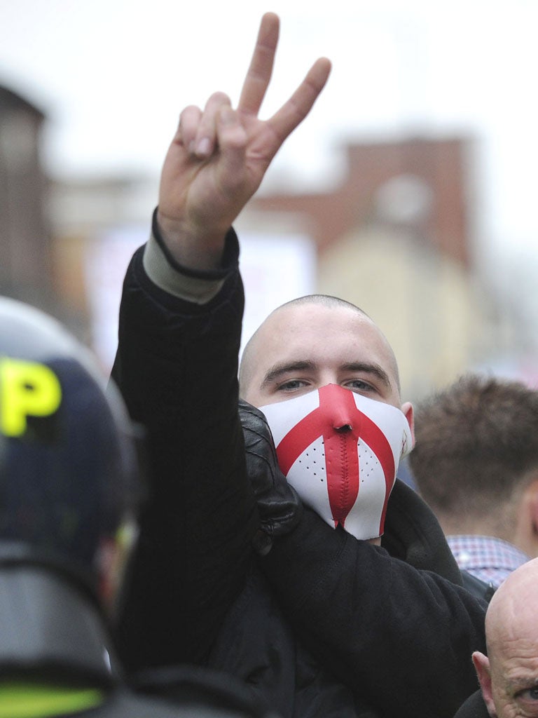 A member of the right-wing EDL (English Defence League) gestures during a rally in Luton