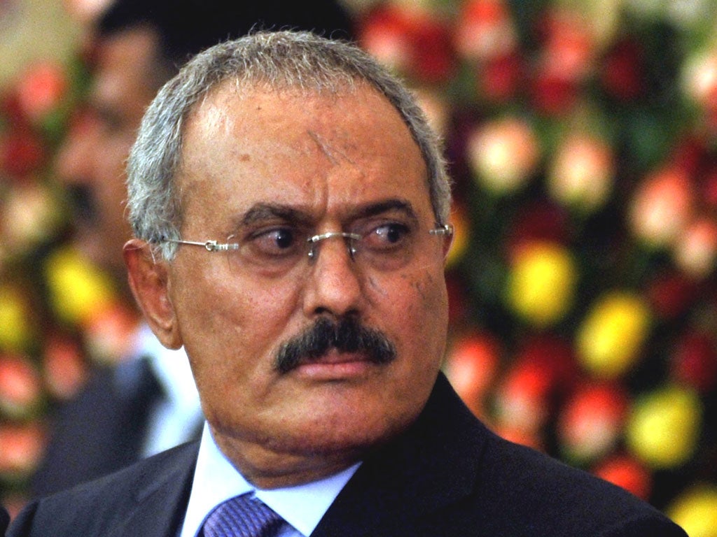 Former Yemeni president Ali Abdullah Saleh looks on after he formally handed power to newly elected president Abdo Rabbo Mansour Hadi