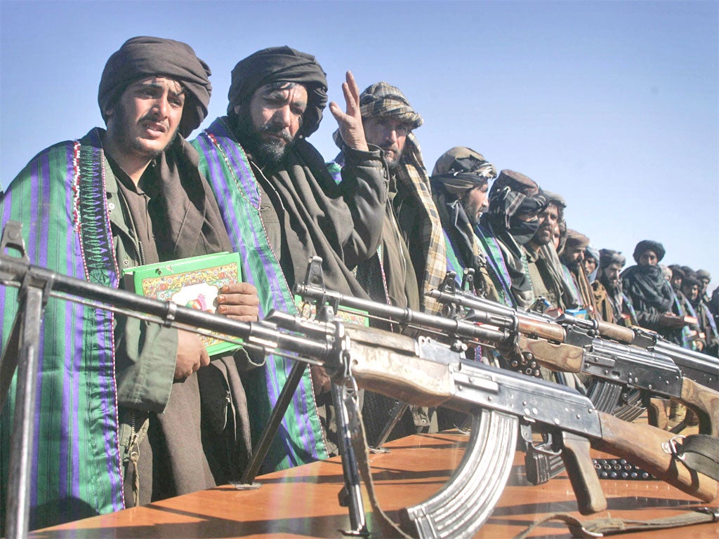 Weapons are handed in by former Taliban fighters as part of the reconciliation efforts of the Afghan government in Herat in January