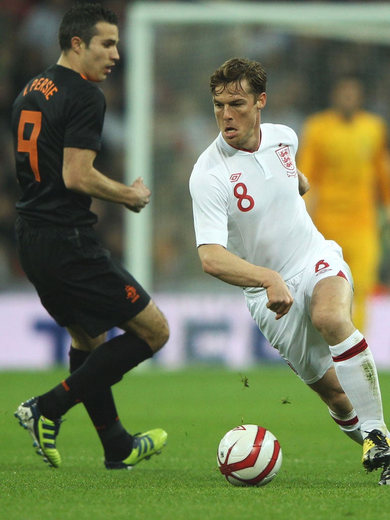 England captain Scott Parker eases past Robin van Persie