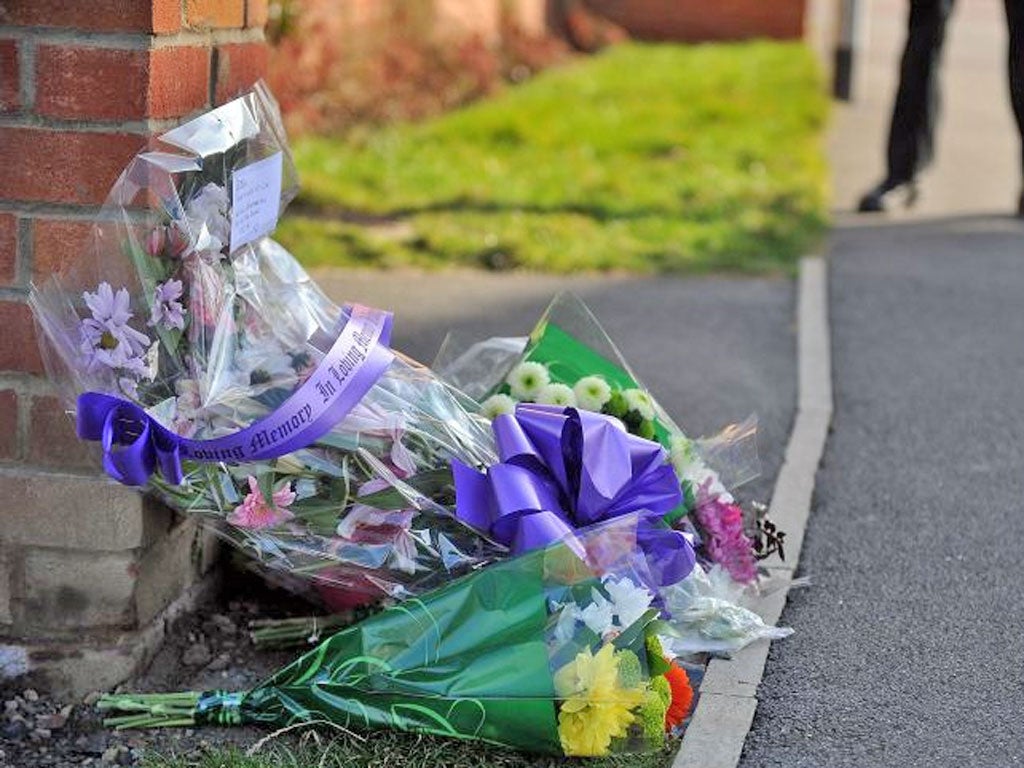 Floral tributes left outside the home of PC David Rathband yesterday