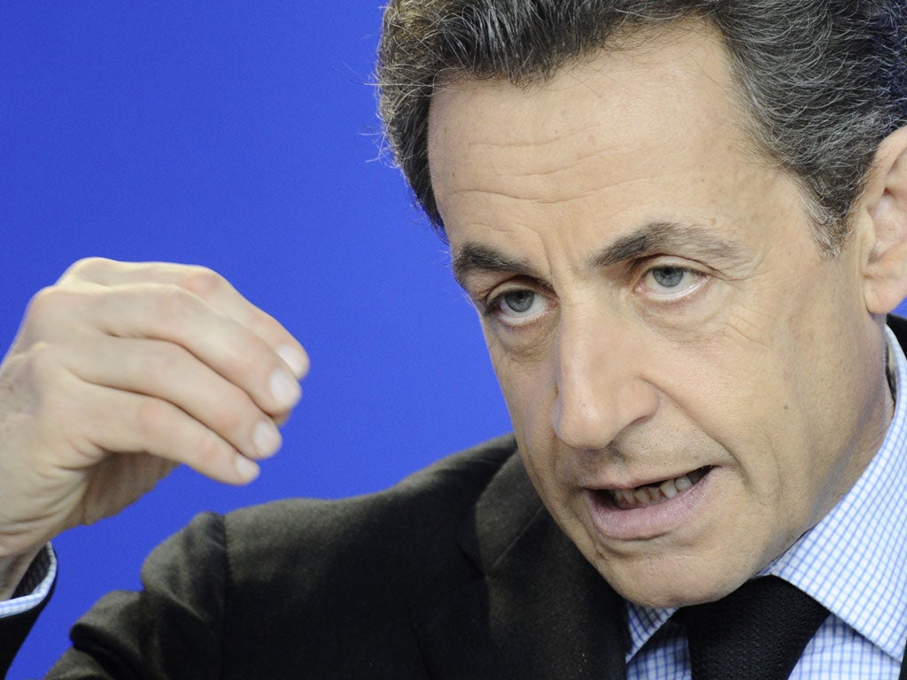 President Sarkozy speaks at an EU summit in Brussels yesterday