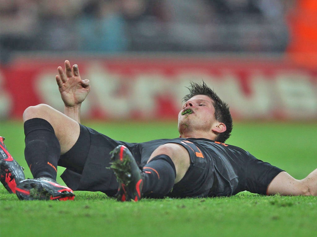 Klaas-Jan Huntelaar gets a mouthful of Wembley grass on Wednesday