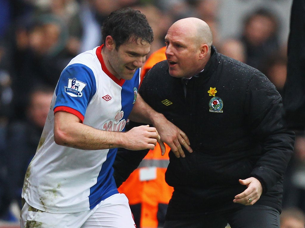 Rovers' David Dunn is congratulated by his manager, Steve Kean