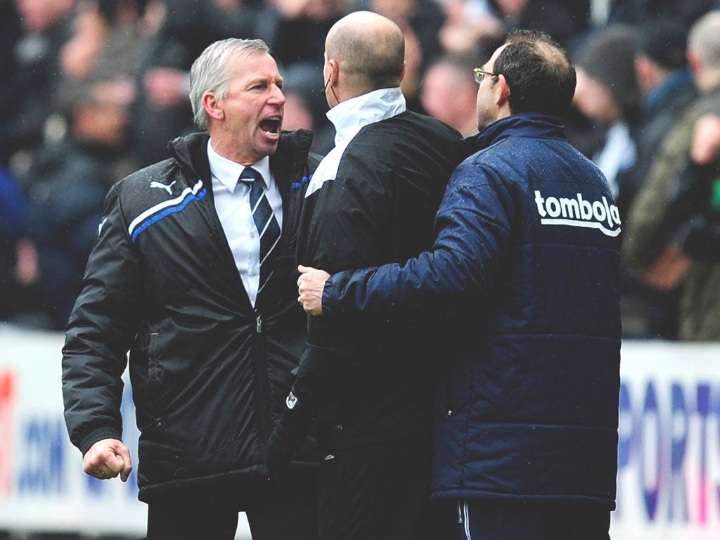 Martin O’Neill is kept apart from Alan Pardew by the fourth official