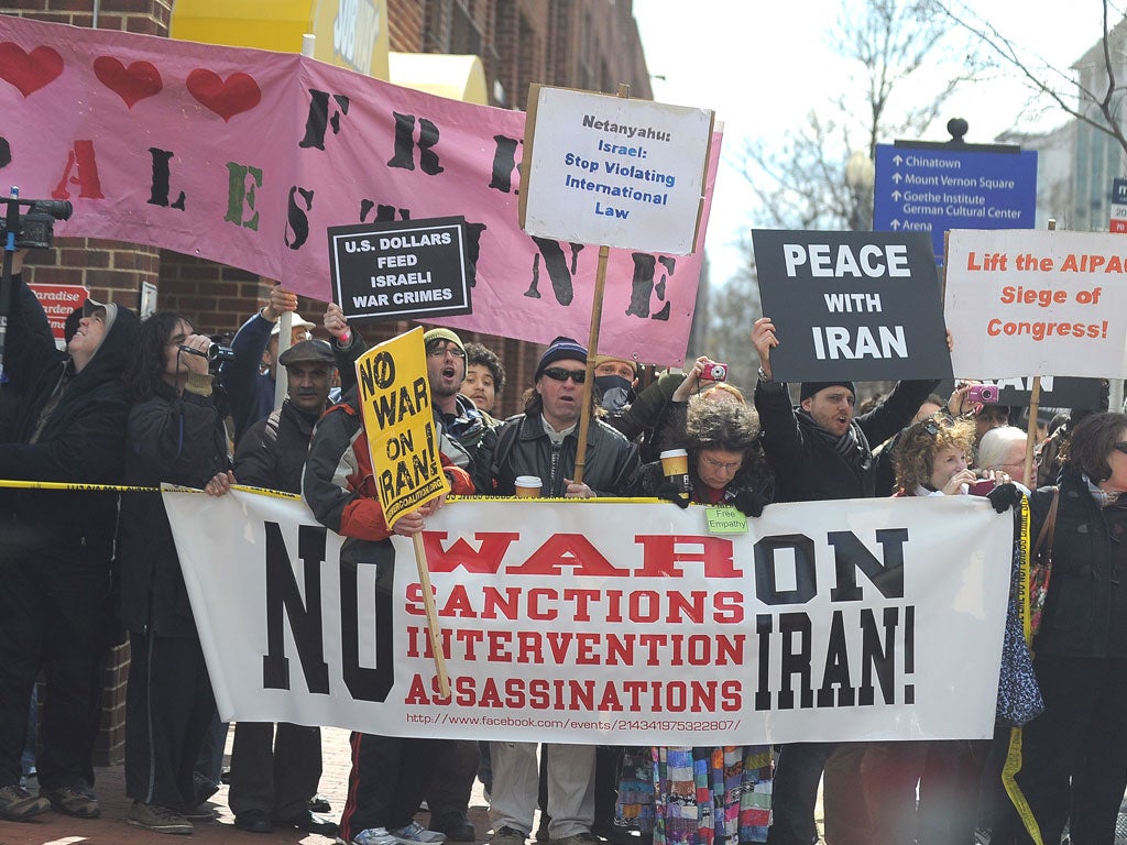 Occupy protesters shout at Barack Obama’s car as the President leaves
the Aipac policy conference in Washington DC yesterday