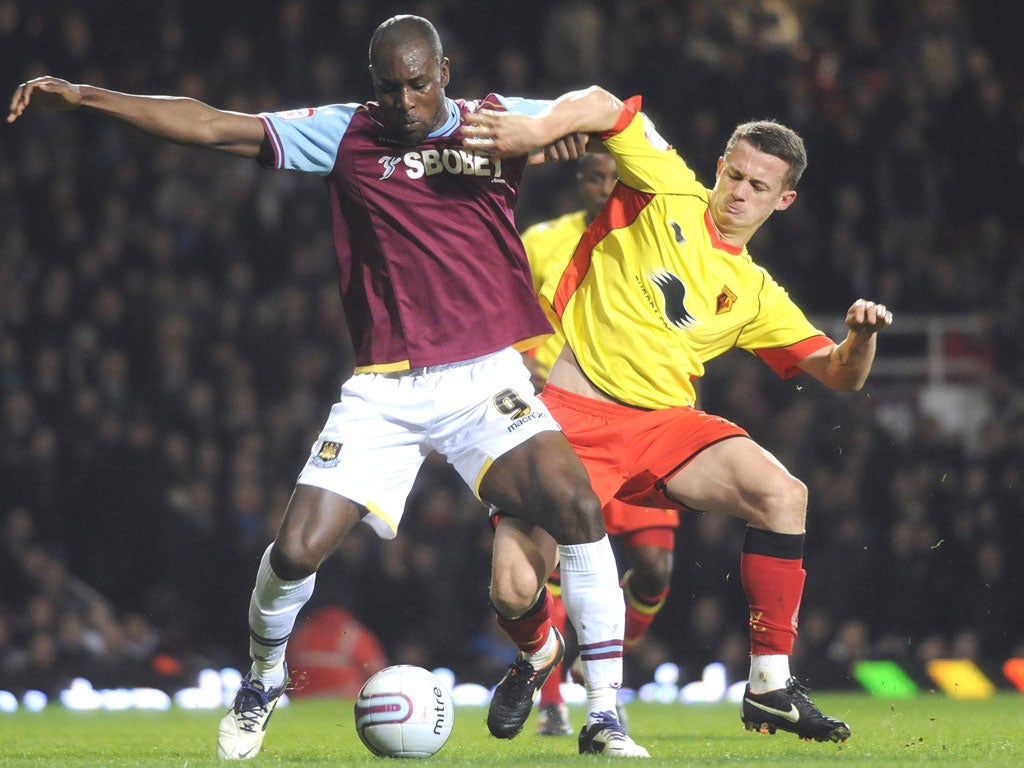 West Ham’s Carlton Cole holds off Jonathan Hogg last night