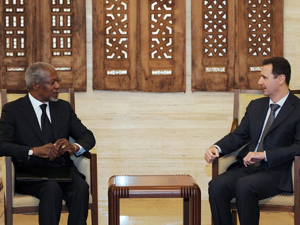 Syrian President Bashar Al-Assad (right) meeting with UN-Arab League envoy Kofi Annan (left) at the Syrian presidential palace in Damascus