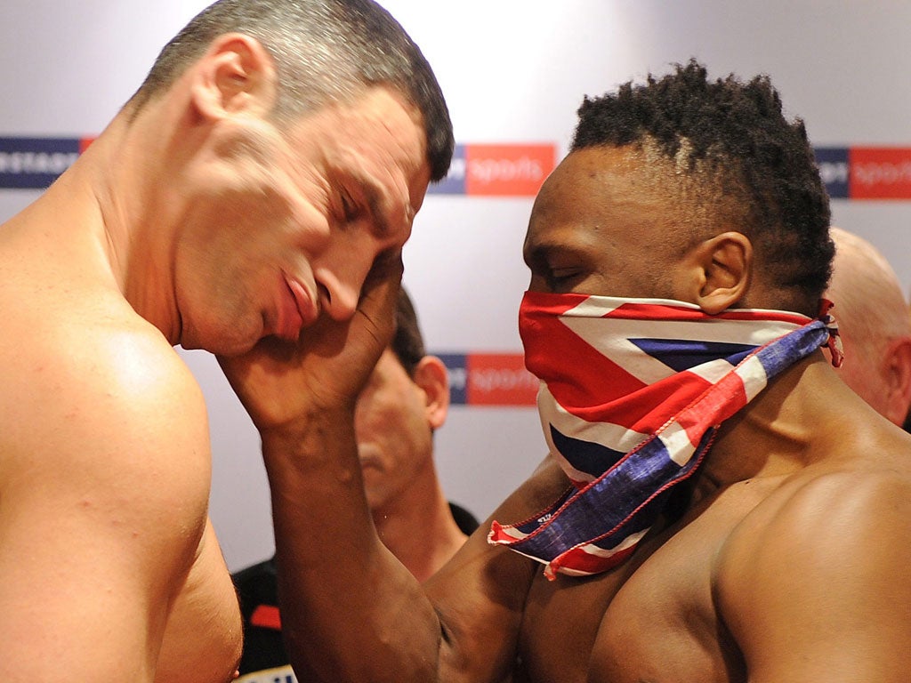 Chisora slaps Vitali Klitschko at the weigh-in in Munich