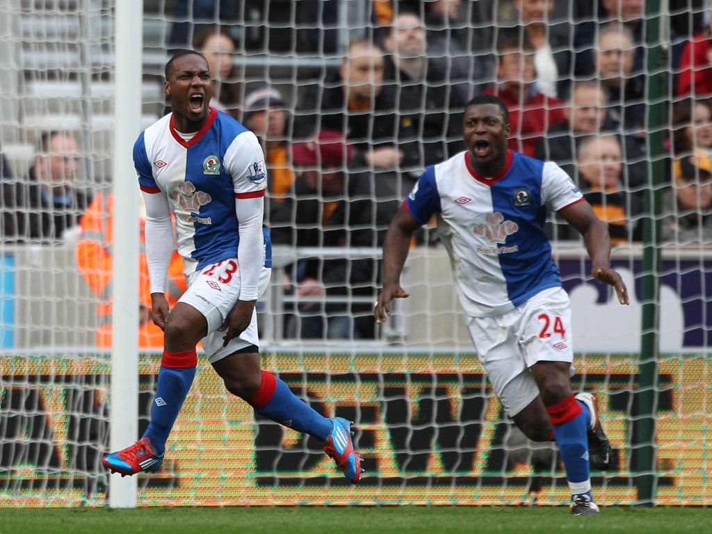 Wild Rovers: Junior Hoilett (left) and Yakubu Ayegbeni celebrate Blackburn's opening goal at Molineux yesterday