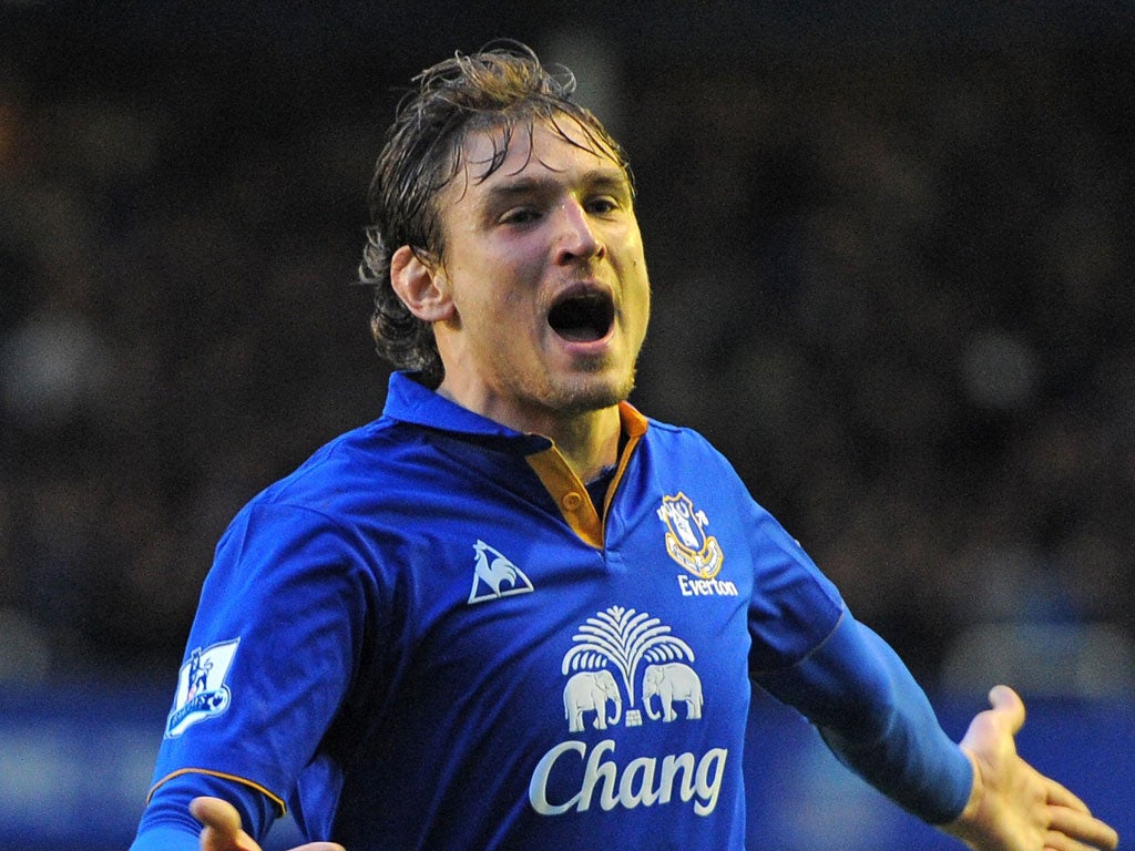 Everton's Croatian striker Nikica Jelavic celebrates scoring the winning goal