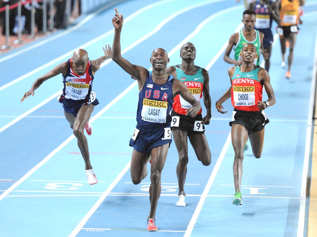 Great Britain’s Mo Farah (left) dips for the line but can only finish fourth, well behind the winner, Bernard Lagat (centre), in the final of the men’s 3,000m yesterday