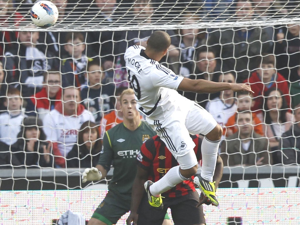 Luke Moore’s header beats Joe Hart in the City goal yesterday