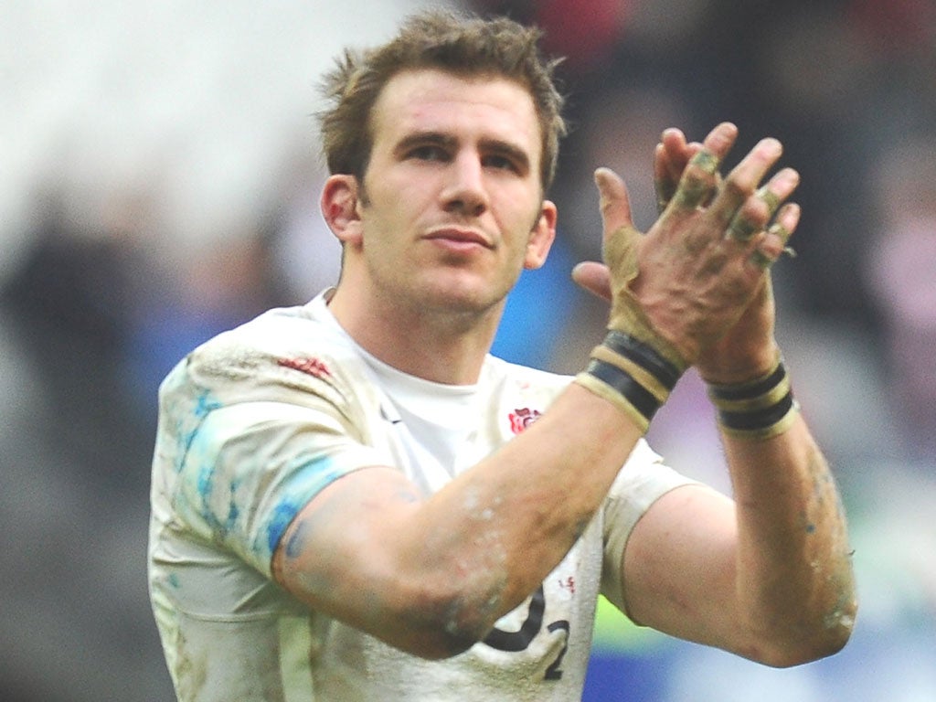 Tom Croft applauds the travelling England fans at Stade de France
