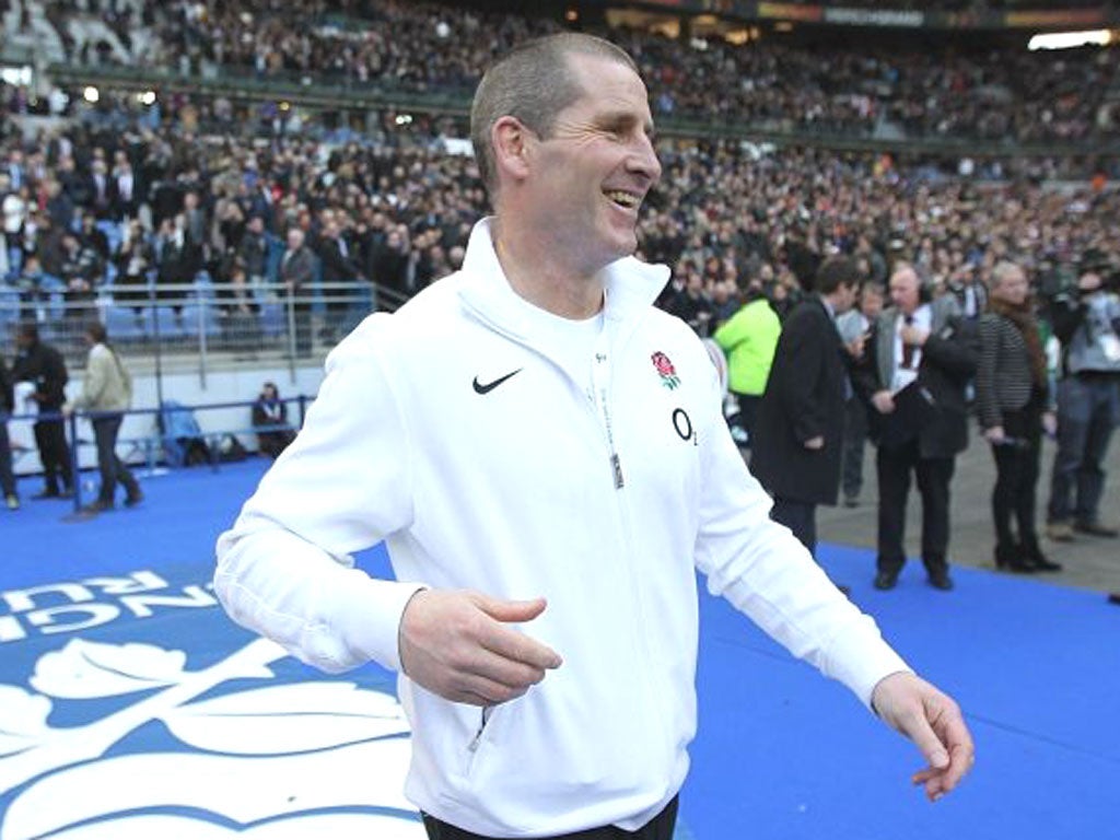 Stuart Lancaster celebrates after England’s 24-22 win against
France in Paris