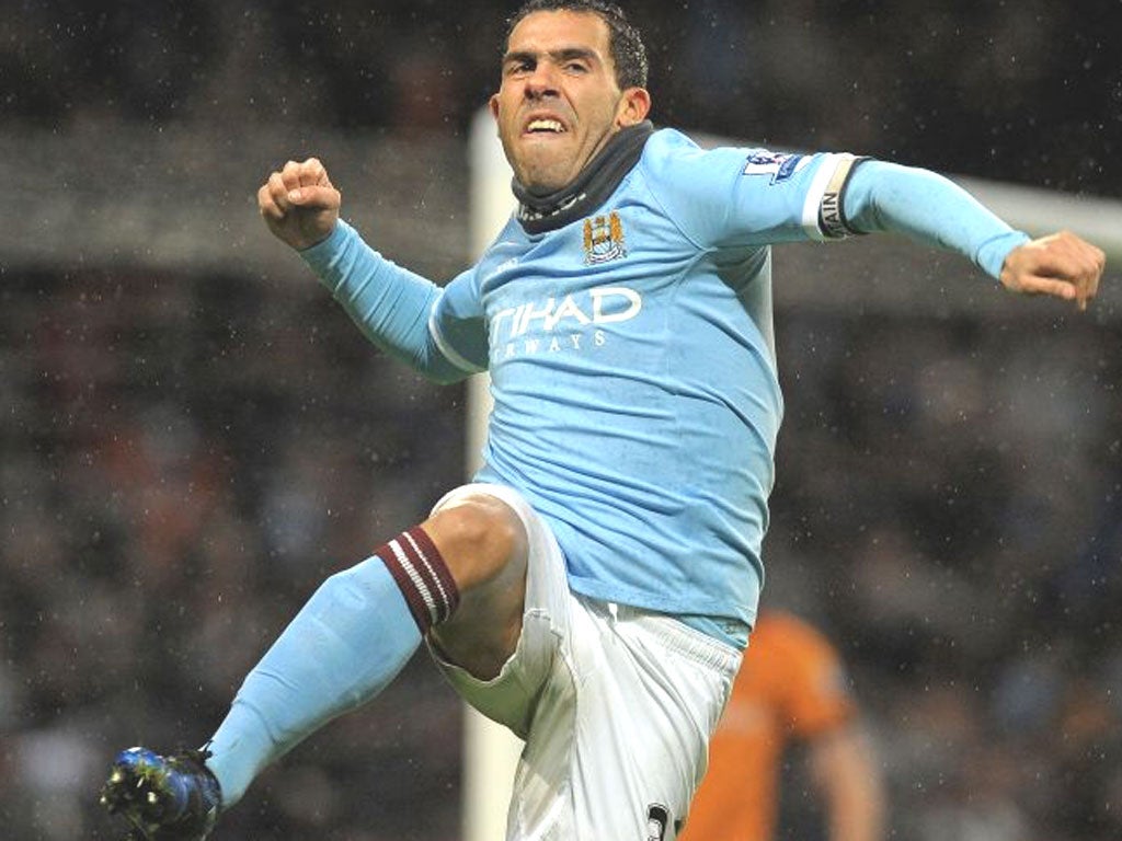 Carlos Tevez in happier times for City – can he play a part in the title run-in?