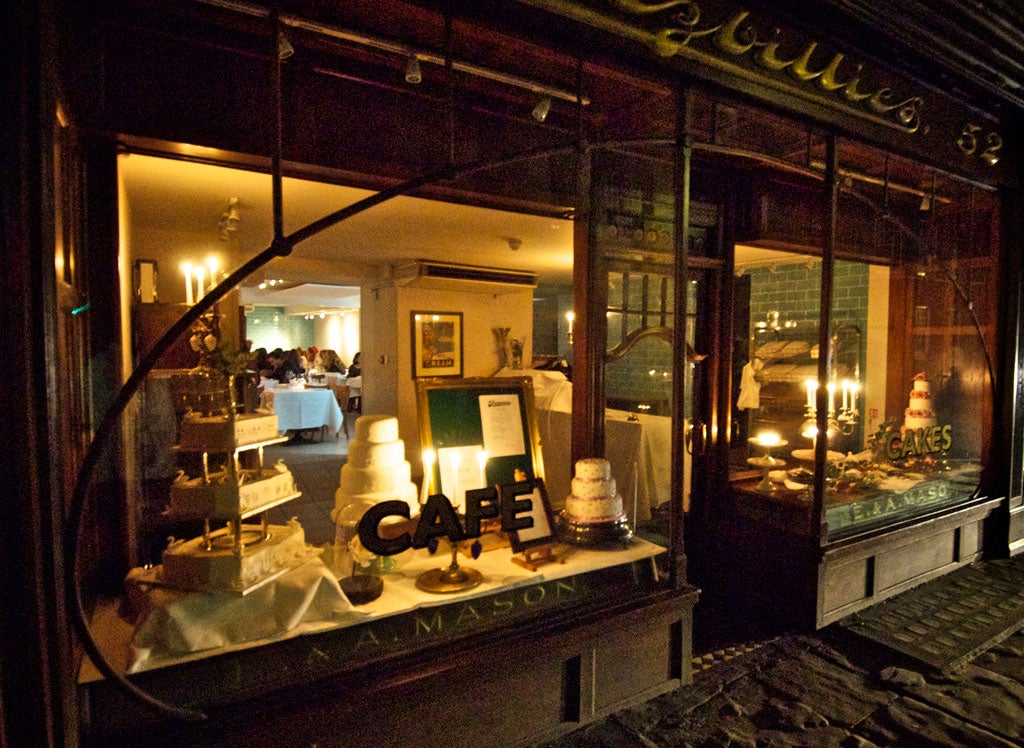 Fitzbillies' art nouveau windows display the kind of many-tiered wedding cake that Downton's Mrs Patmore might have sweated over for days