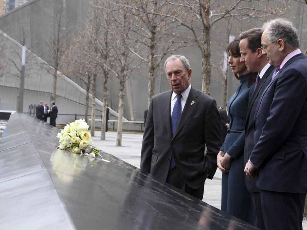 David Cameron stands with his wife Samantha Cameron and New York City Mayor Michael Bloomberg at the World Trade Center Memorial