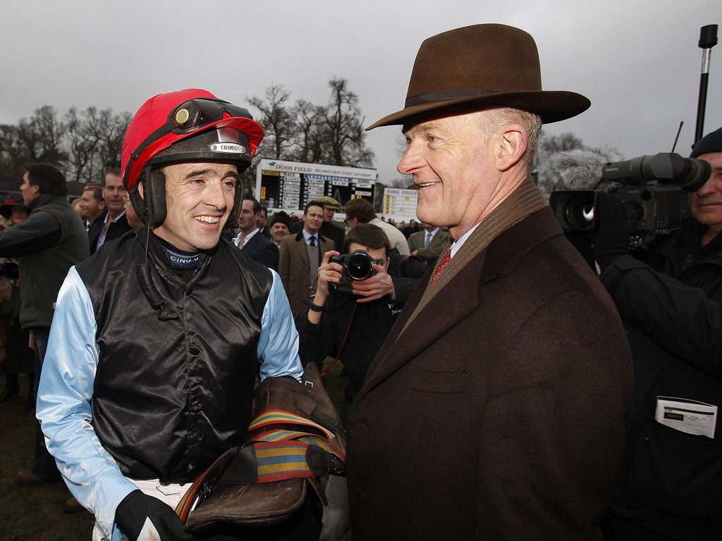 Willie Mullins (right) trains Boston Bob, the favourite for the Albert Bartlett Hurdle today