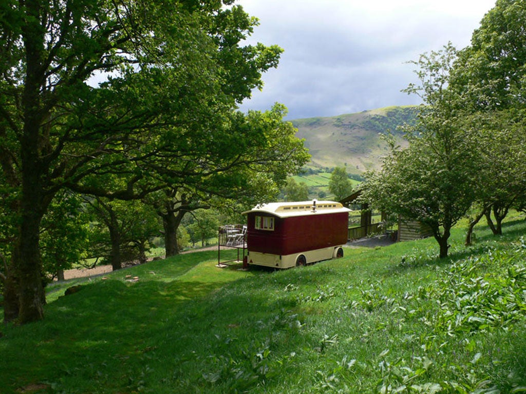 Showman's Wagon, Shropshire

<p>Built in the 1920s and carefully restored, this wagon has a colourful interior that screams for attention - from the painted ceiling and paisley carpet to the Tiffany lamps, panelled walls and lace curtains. The all-singing, all-dancing colour scheme within is matched outside by a vision of rural calm, with wide views out across north Shropshire's small but picturesque lake region.</p>

<p>Showman's Wagon, English Frankton, Ellesmere, Shropshire SY12 0JX (0844 500 5101; underthethatch.co.uk). Two nights' rental starts from £157. Sleeps two.</p>
