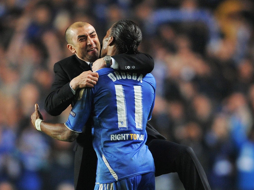 Chelsea manager Roberto Di Matteo enjoys the defeat of Napoli with Didier Drogba